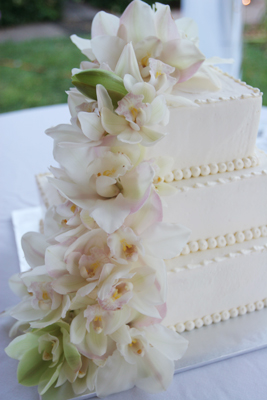 white butter cream cake with orchids