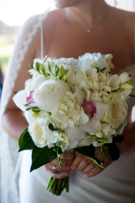 white brides bouquet orchids and peonies