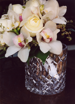 cream roses with white orchids in brides flowers
