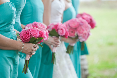 aqau bridemaids with pink flowers
